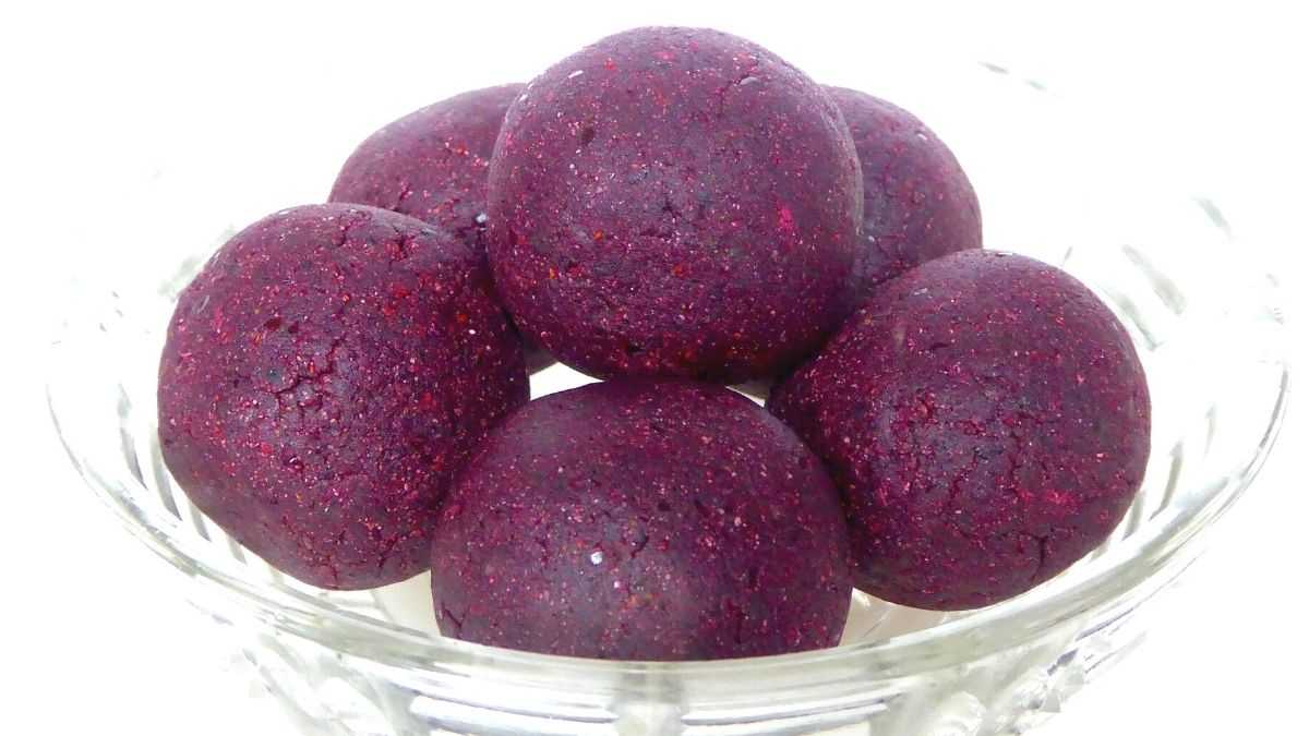 healthy bliss balls stored in glass bowl