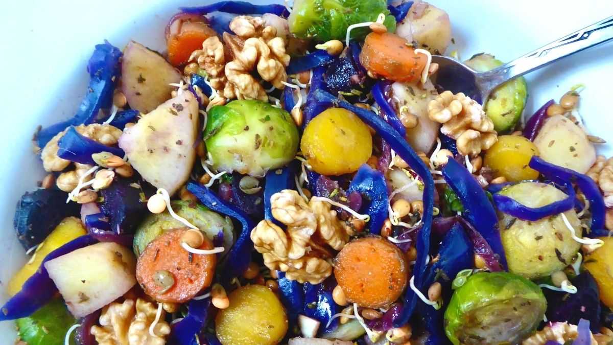 showing the top half of vegan hash served in a bowl with a serving spoon