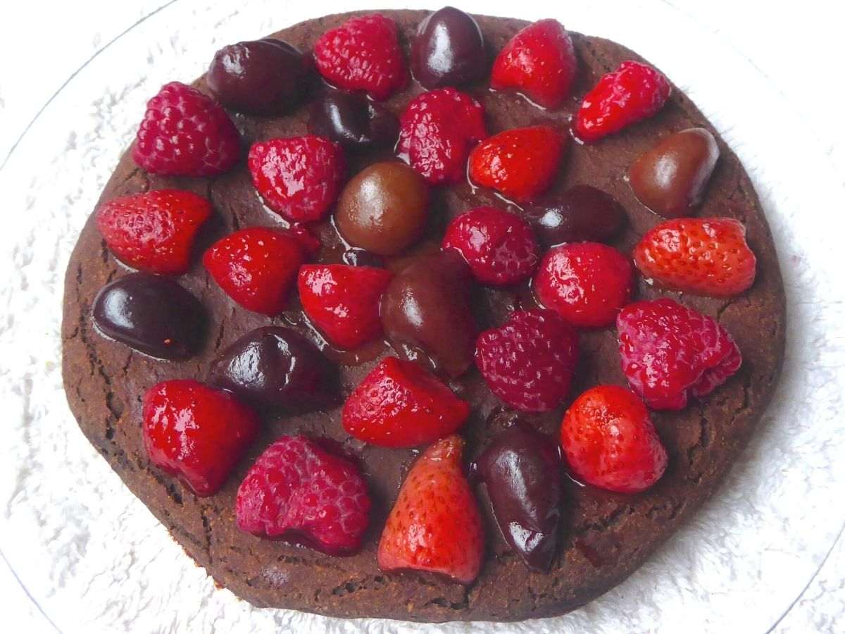 full view of chocolate pancake served with berries