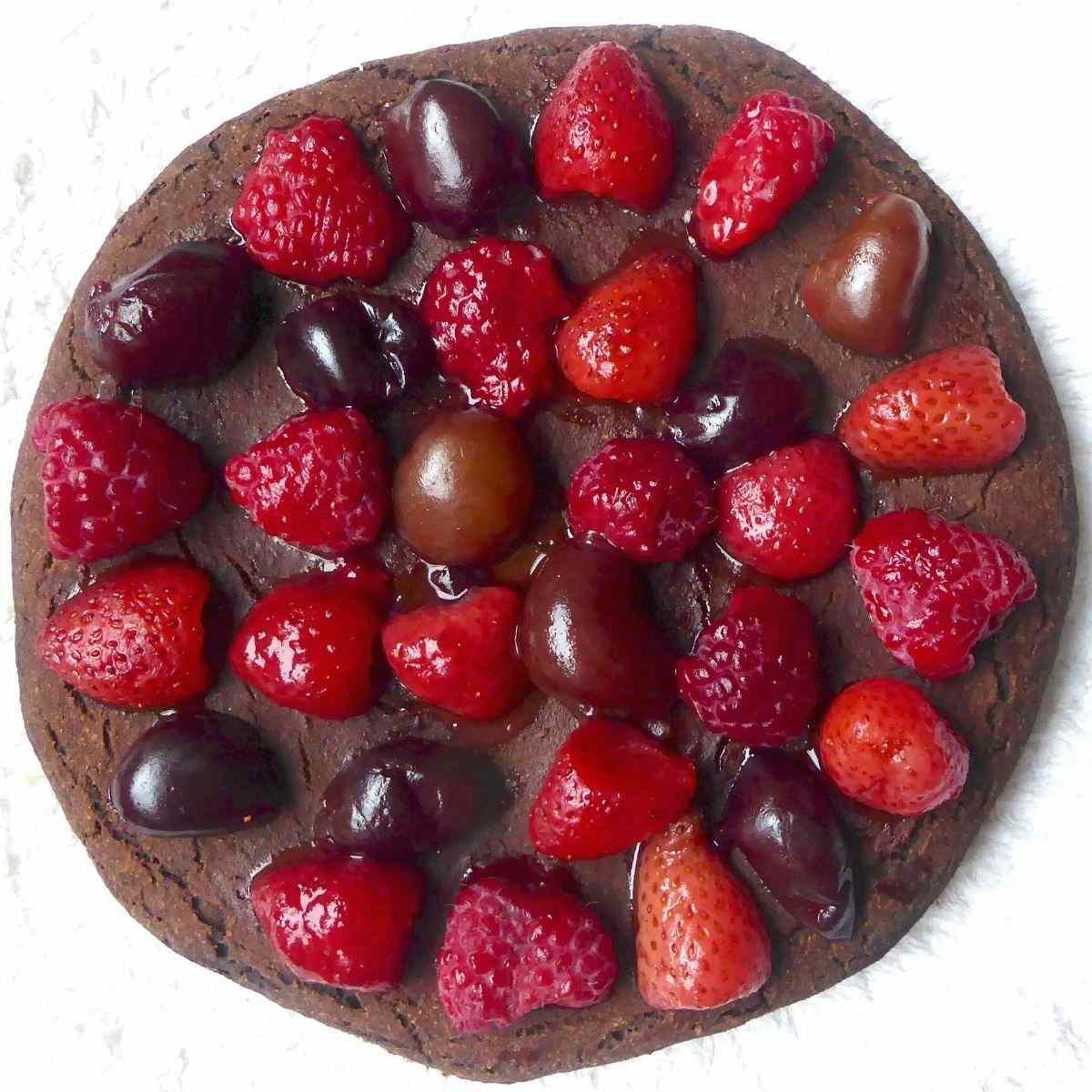 Birdseye view showing the whole chocolate pancake topped with berries