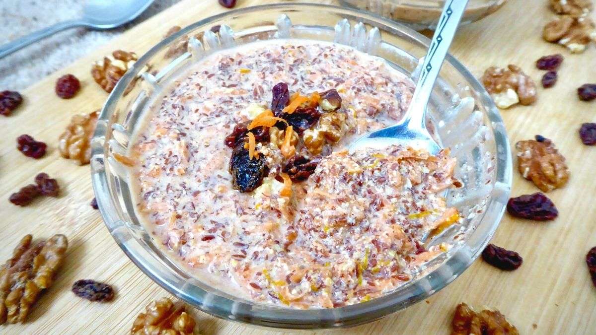 pudding in a bowl with spoon inserted showing one mouthful. 