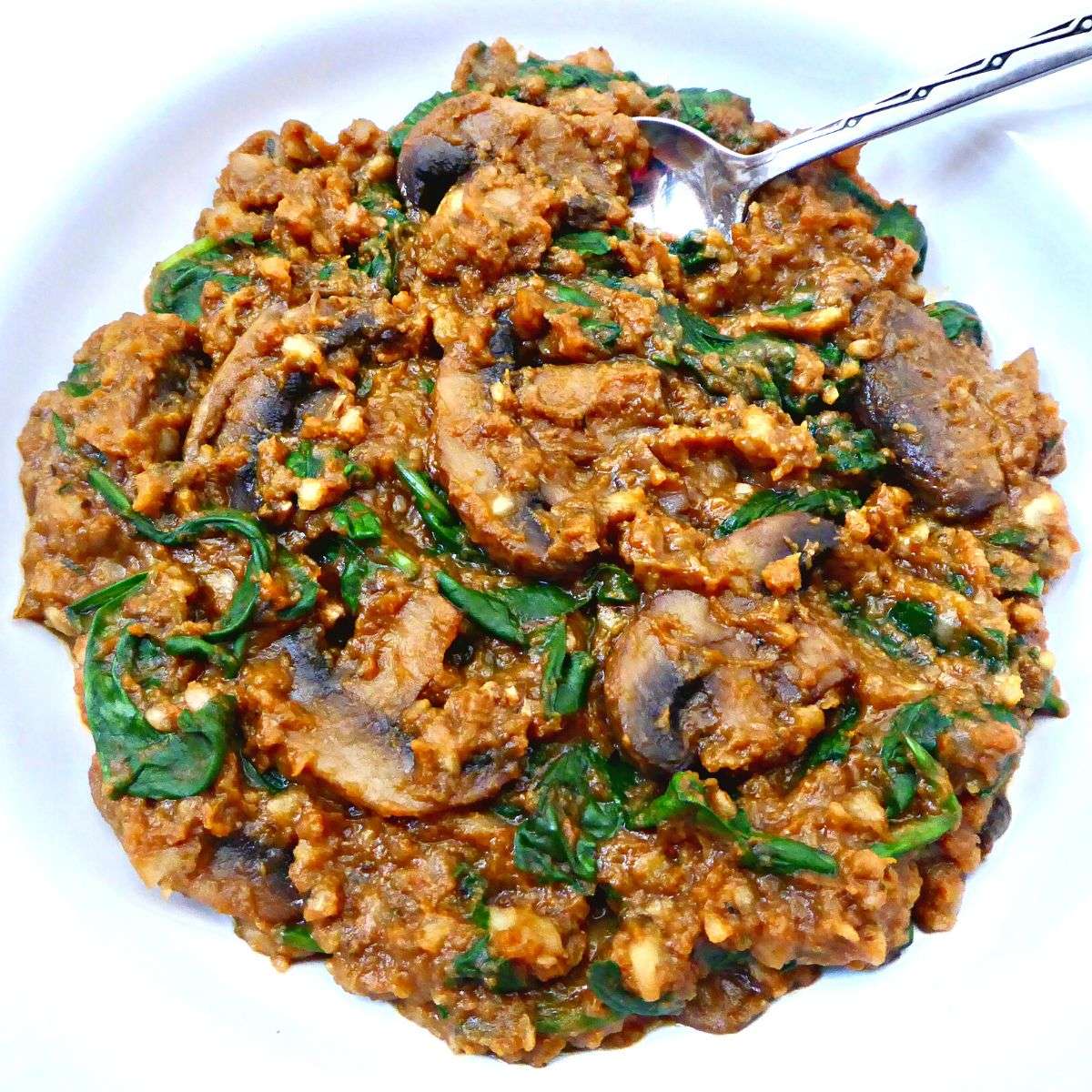 pumpkin mushroom and spinach risotto served in bowl